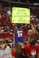 fan of kobe bryant holds up sign.jpg