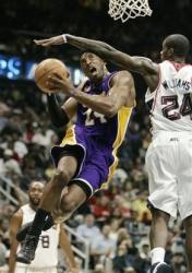 Kobe is fouled on the head as he knifes to the goal.jpg
