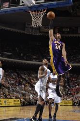 Kobe soars for a dunk with mouth open.jpg