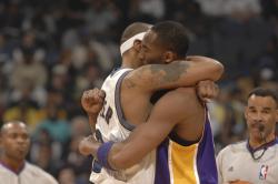 kobe caron butler embrase fullj.getty   lakers wiz 8 42 13 pm.jpg