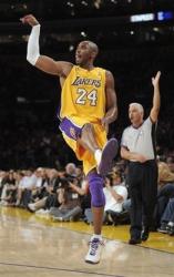 Kobe sticks out his tongue and poses after launching a 3.jpg