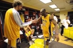 Kobe Bryant high fives Pau Gasol in the locker room.jpg