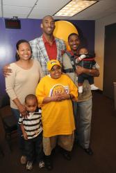 Kobe Bryant poses for a picture with the the family of a Make-a-Wish Participant.jpg