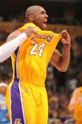 Kobe celebrates by tugging his jersey.jpg