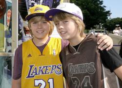 Laker fans Dylan Sprouse and Cole Sprouse wearing Laker Jerseys.jpg
