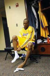 Kobe Bryant puts on his socks.jpg