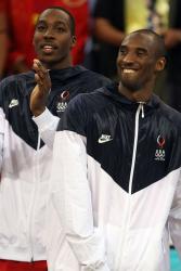 Kobe Bryant in his Olympics Nike jacket alonside Dwight Howard.jpg