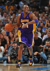 Kobe Bryant shows his teeth as he brings the ball up.jpg