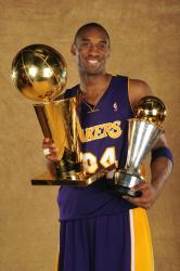 Kobe Bryant poses with both Larry O'Brien trophy and his 2009 NBA Finals MVP trophy.jpg