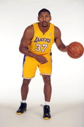 Ron Artest dribbling a basketball in a Lakers jersey.jpg