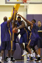 Ron Artest is triple teamed by fellow Laker teammates down low during practice.JPG