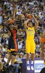 Shannon Brown shoots a jumper as Corey Maggette defends.JPG