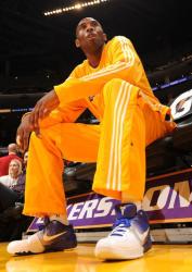Good view of Kobe Bryant's shoes as he looks on before a preseason game in 2009.JPG