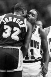 Black and white photo of Magic Johnson greeting Isiah Thomas.JPG