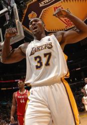 Ron Artest flexes his arms after making a bucket against Houston.JPG