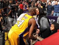 Kobe Bryant kisses his wife Vanessa Bryant following a Lakers win at Staples Center.JPG