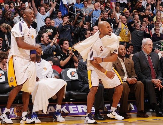 Kobe Bryant and Derek Fisher celebrate a play from the bench.JPG