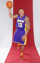 Shannon Brown poses for a dunk with tongue out.JPG