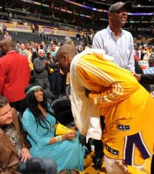 Kobe Bryant talks to his mother Pam as his dad looks on.JPG