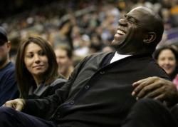 Magic Johnson has a laugh as he watches a Lakers Nets game.JPG