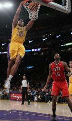 Shannon Brown 2 handed dunk as Al Horford watches.JPG