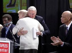 Jerry Buss hugs Jerry West with Kareem and Elgin Baylor by their sides.JPG