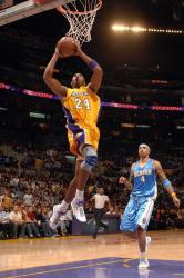 Kobe Bryant elevates for a two handed dunk.jpg